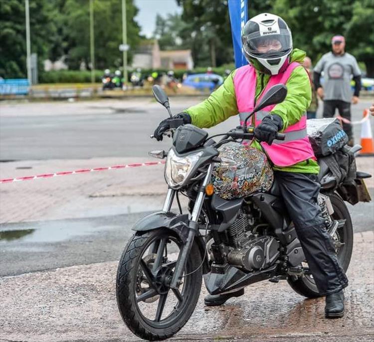 Sharon in high vis at a lady rider's event with the keeway painted