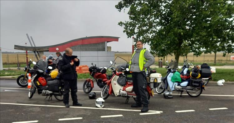 One tall rider stand proud among the group of small capacity motorcycles