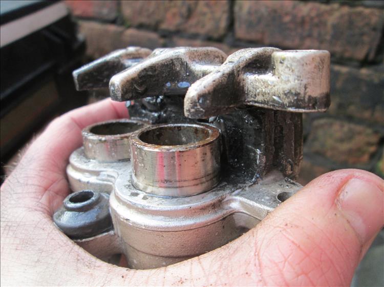 Cleaned pistons ready to be pushed back into their bores