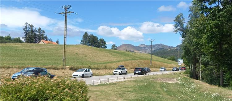 Beautiful alpine scenery but the road is busy with cars
