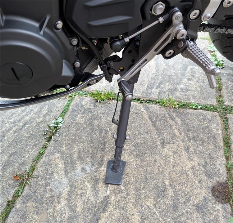 The stand on the bike has a tube within a tube and a bolt through it to make it adjustable