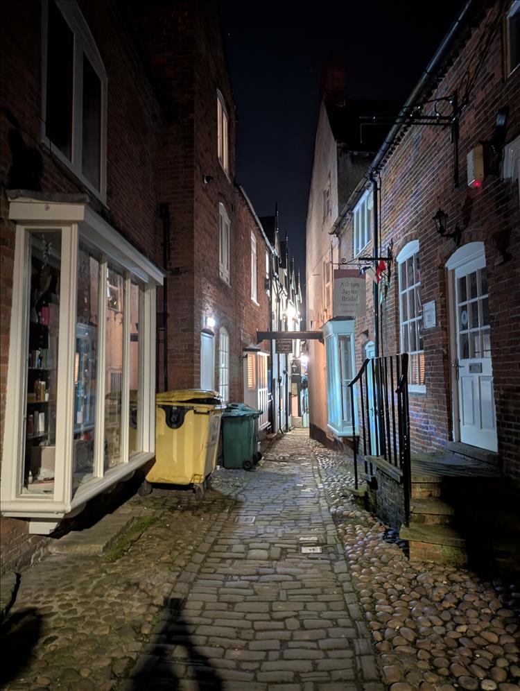 A narrow lane with qute shops at Ashbourne in the night time