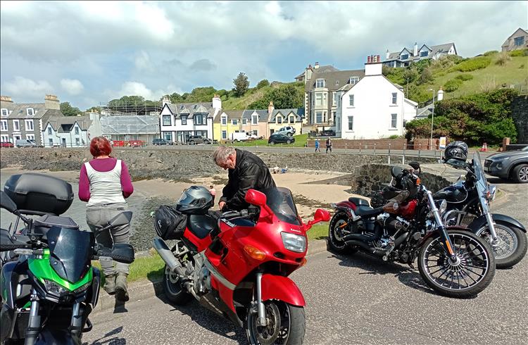 4 bikes, Sharon and Mark and the houses around the harbour of Portpatrick