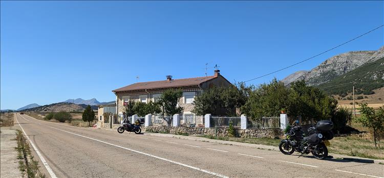 The bikes against blue skies and arid hills on the Spanish roads