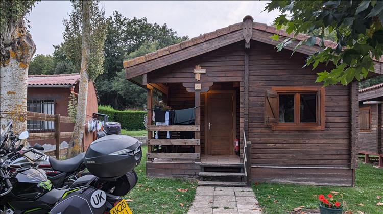 The bikes out front of a timber lodge on the campsite