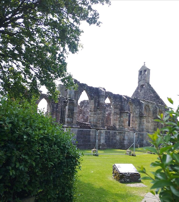 The old abbey in ruins and with wire fence around it