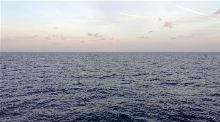The calm sea and the sunrise in clear skies across the Bay of Biscay