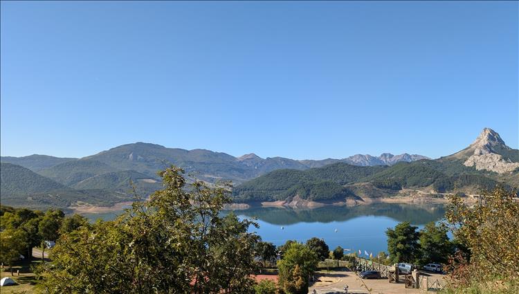 Clear blue skies, majestic mountains, glorious reservoir in Riano