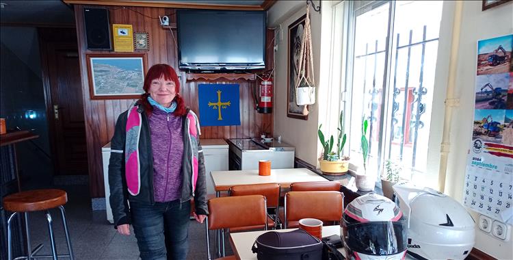 Sharon smiles in the simple surroundings of a local Spanish cafe