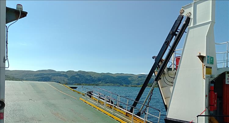 Looking over the ramp of the ferry we see green hills on the isle of Bute