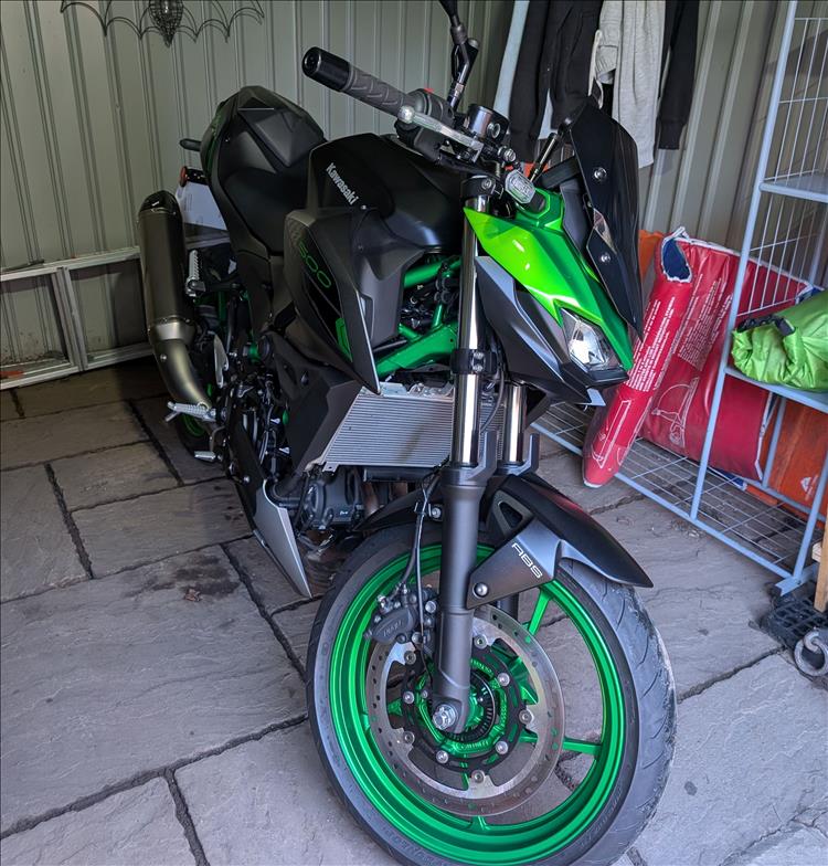 We see the bike in the shed from the front this time