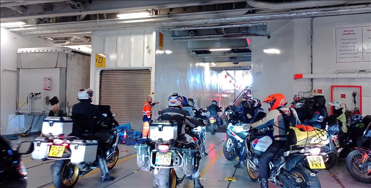 An array of motorcycles in the bowels of the ferry waiting to be allowed off the boat