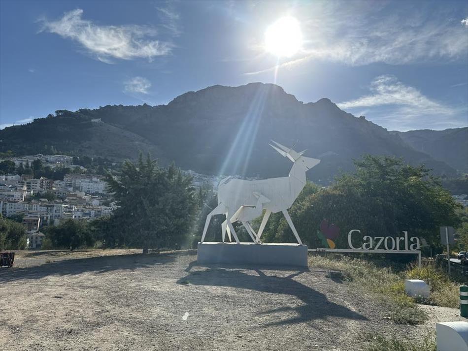 A deer and calf design looking like origami and the town name Cazorla, again clear skies and a big mountain