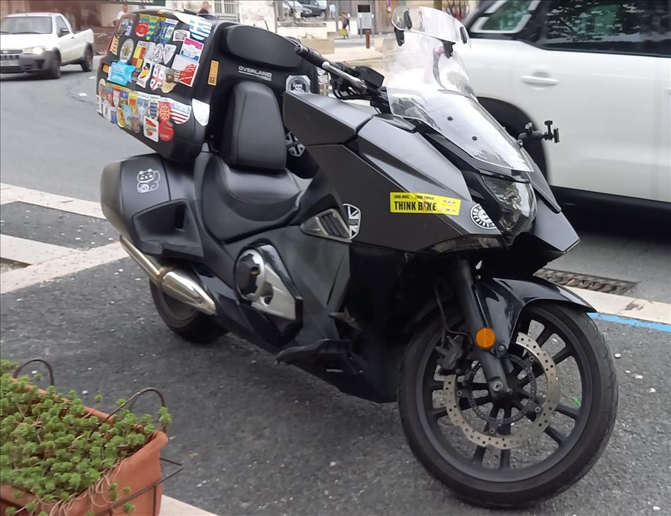 Honda actually make a feet forward motorcycle, this one has a top box and a screen