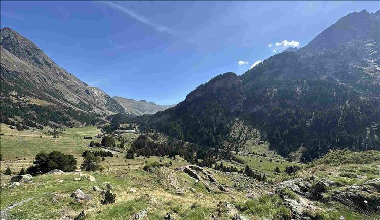 Vast broad valley and we can just make out a white town in the distance, amaazing scenery