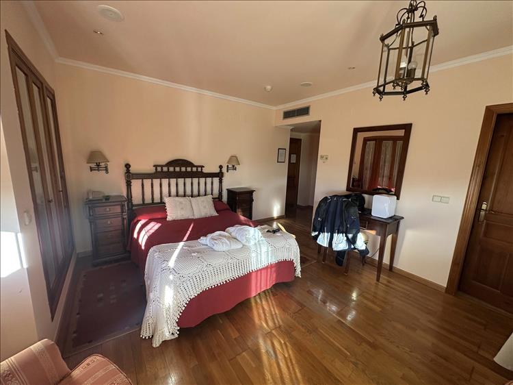 A smart clean room with bed and cupboards, quite spacious