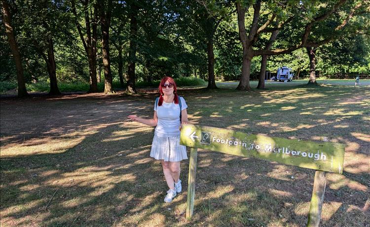 In the sun and the trees Sharon's smiling and ready for a walk