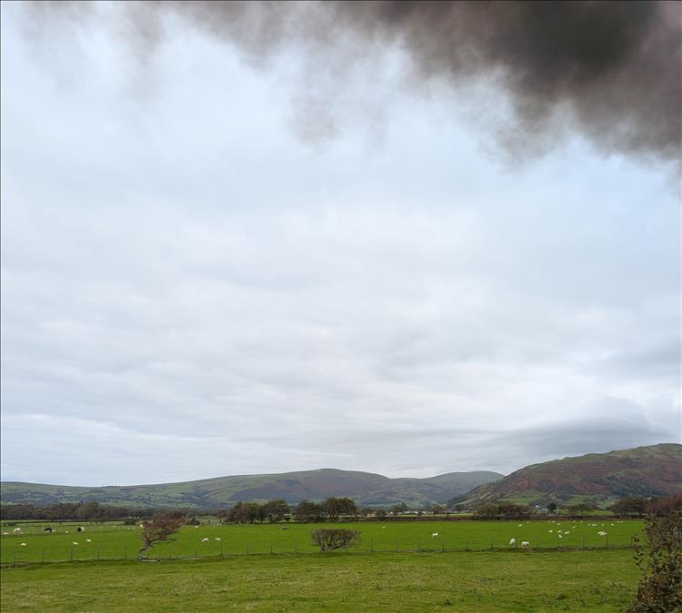 Welsh hills, a green broad valley, and the smoke from the engine