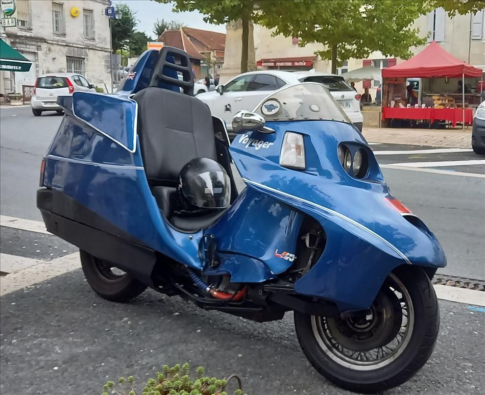 A motorcycle that you sit in rather than on, like a car. IT looks well made but no idea what it is