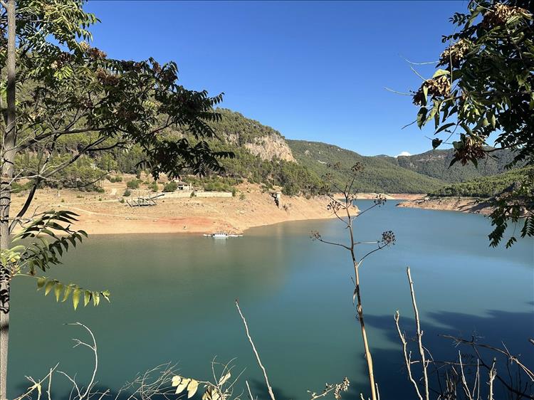 A reservoir with a visible water line and the water is quite some way below that
