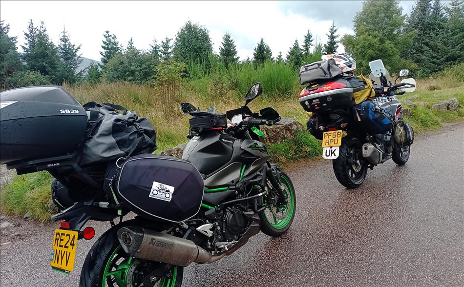 The Z500 and CB500X with luggage in the mist on a mountainside