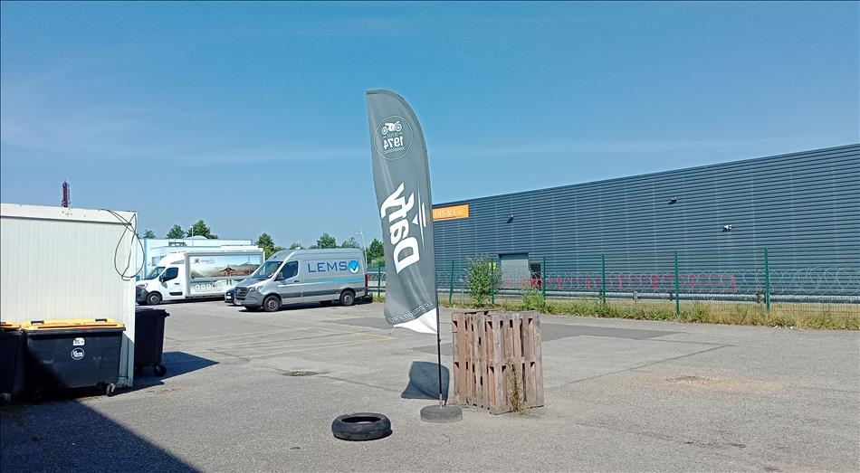 A Dafy flag and a regular large industrial building in France