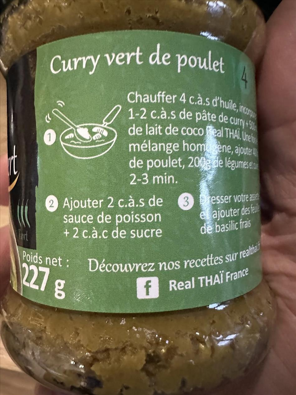 A jar of green curry with french wording on it