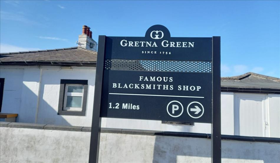 The sign reads Famous Blacksmiths Shop 1.2 miles