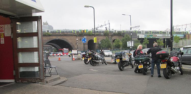 Outside the Ace Cafe you can see a bridge with a train on it and busy bustling roads