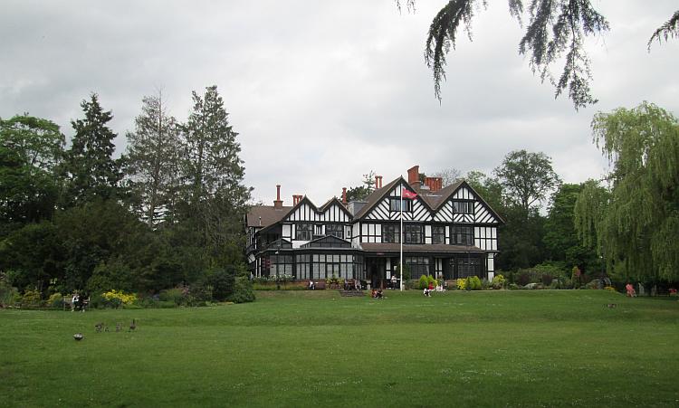 Looking back at the Manor house from the broad well kept garden