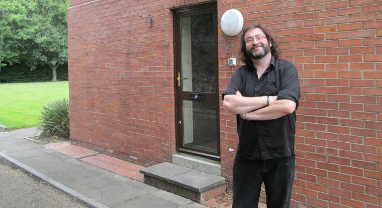 SM, Ren's friend, smiling outside the halls of residence