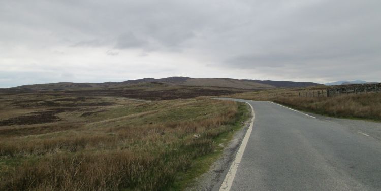 a narrow road winds its way through the Welsh countryside