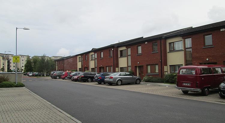 A row of houses with a block of flats in the background. Just an everday view in Dublin