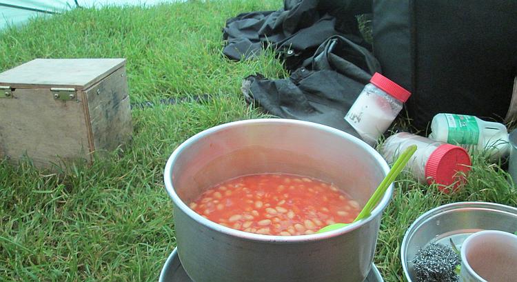 baked beans cooking on my coleman stove inside the tent at home farm