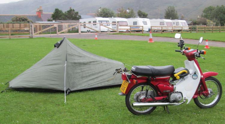 A Honda C90 and a small tent at the campsite in Ullapool