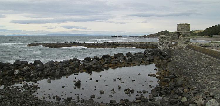 Looking out across the water from Dunure Harbour's wall. Arran in the distance.