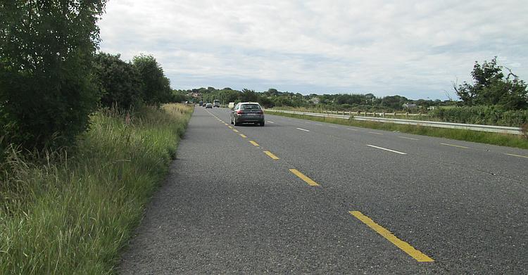 A broad road and the large verge on many of Ireland's main roads