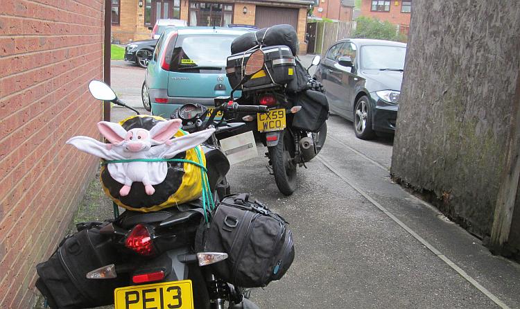 2 125cc motorcycles loaded up with camping gear ready to ride to Bala