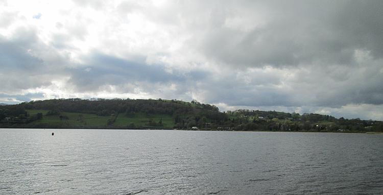 looking across bala's water we see a hill where the campsite is