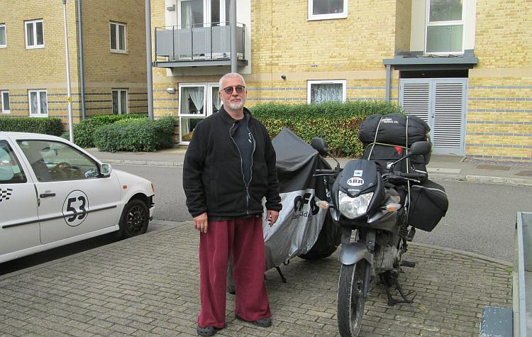 Monk stands casually next to our bikes in Watford