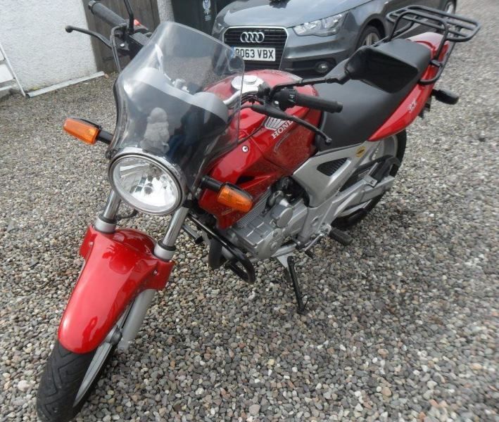 A red Honda CBF 250 in excellent condition