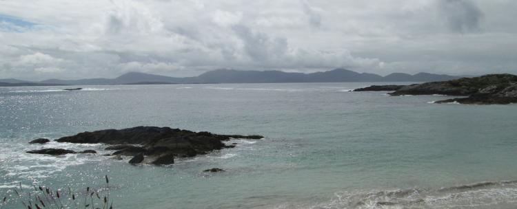 A beach and views across to mountains in the ring of kerry