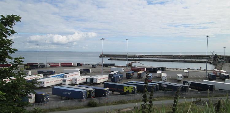 Overlooking Rosslare harbour. A number of truck and a big empty port