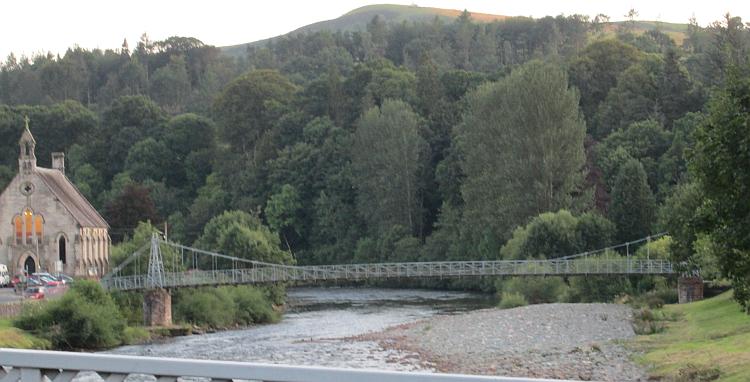 A small and old footbridge across the river in Langholm.