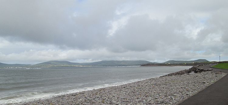 Leaden dark skies over the views across Waterville beach and distant hills