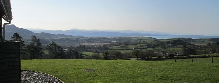 another view from the cottage. Welsh mountains with a little mist and a sunkist bay