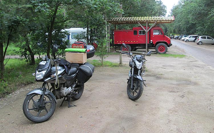 The two 125cc motorcycles being loaded with the camping gear at Distelloo