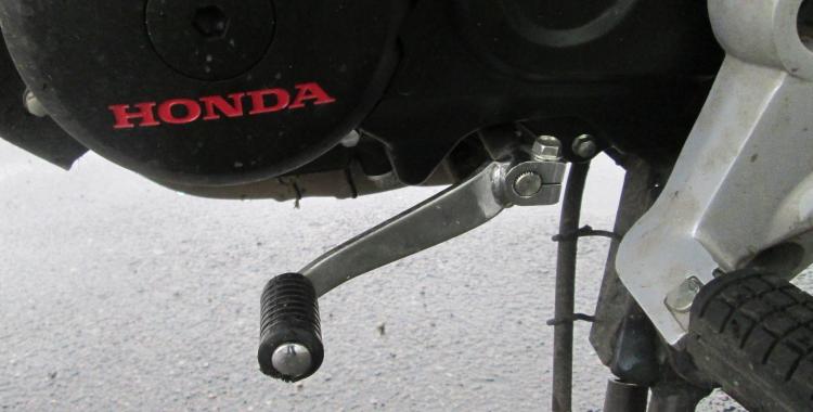The gear lever on the CB125F runs straight into the gearbox
