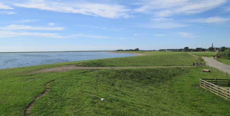 Looking across the IJsselmeer to the Afsluitdijke in the sun