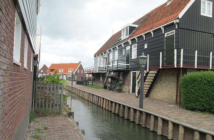 A house , bricks on the bottom half, wood on top, quite old, in Marken